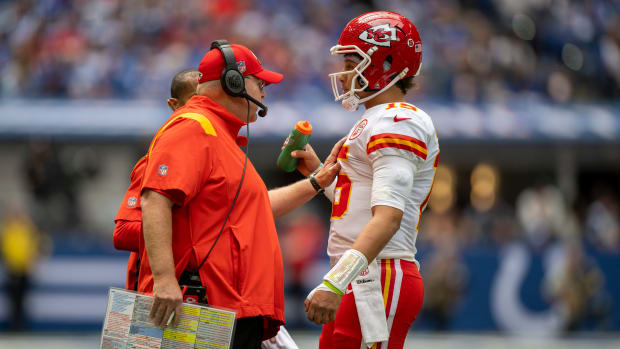 Sep 25, 2022; Indianapolis, Indiana, USA; Kansas City Chiefs head coach Andy Reid (left) talks with quarterback Patrick Mahomes (15) during the second quarter against the Indianapolis Colts at Lucas Oil Stadium. Mandatory Credit: Marc Lebryk-USA TODAY Sports